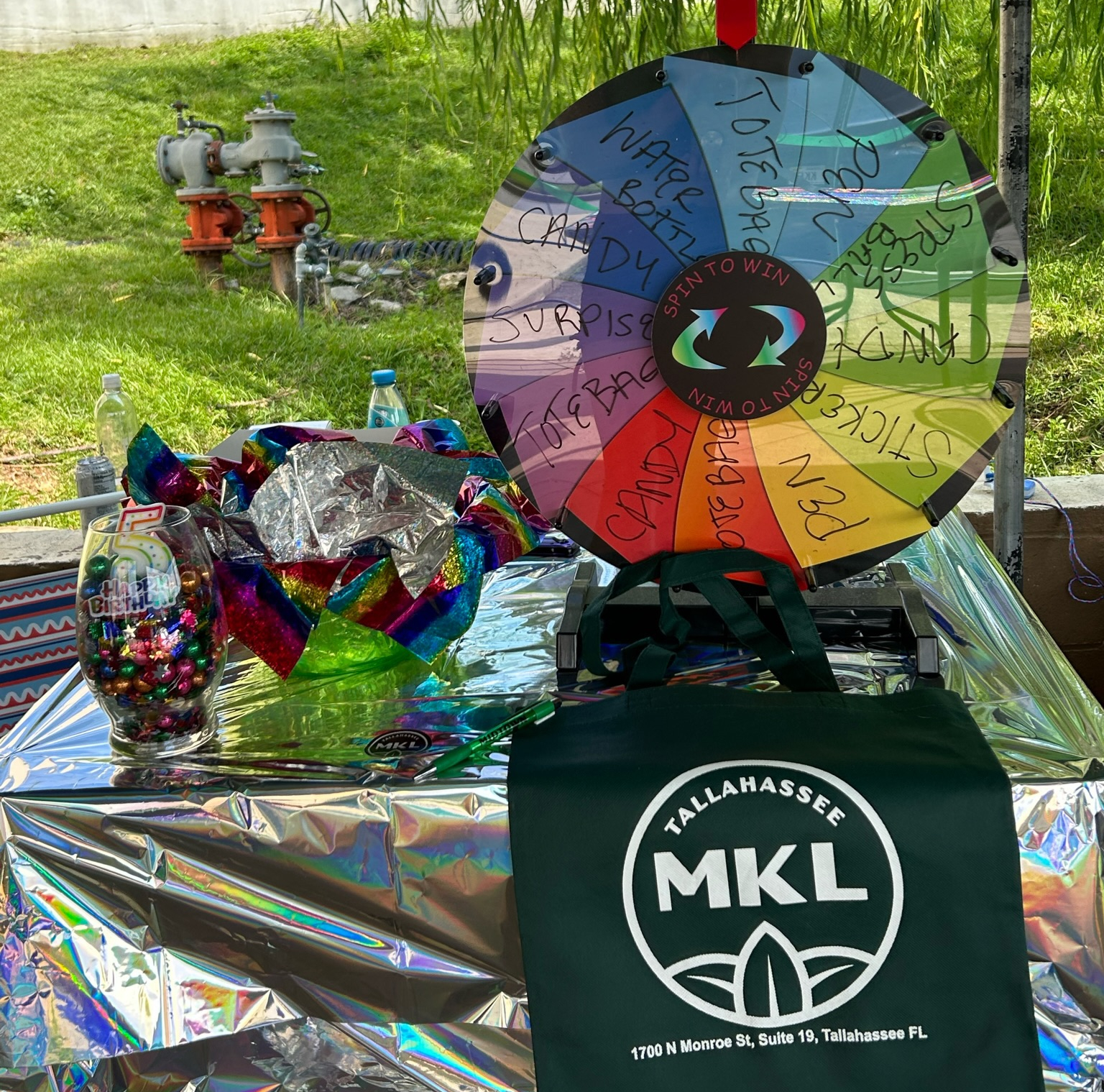 The table outside MKL with the wheel of gifts ready to be spun