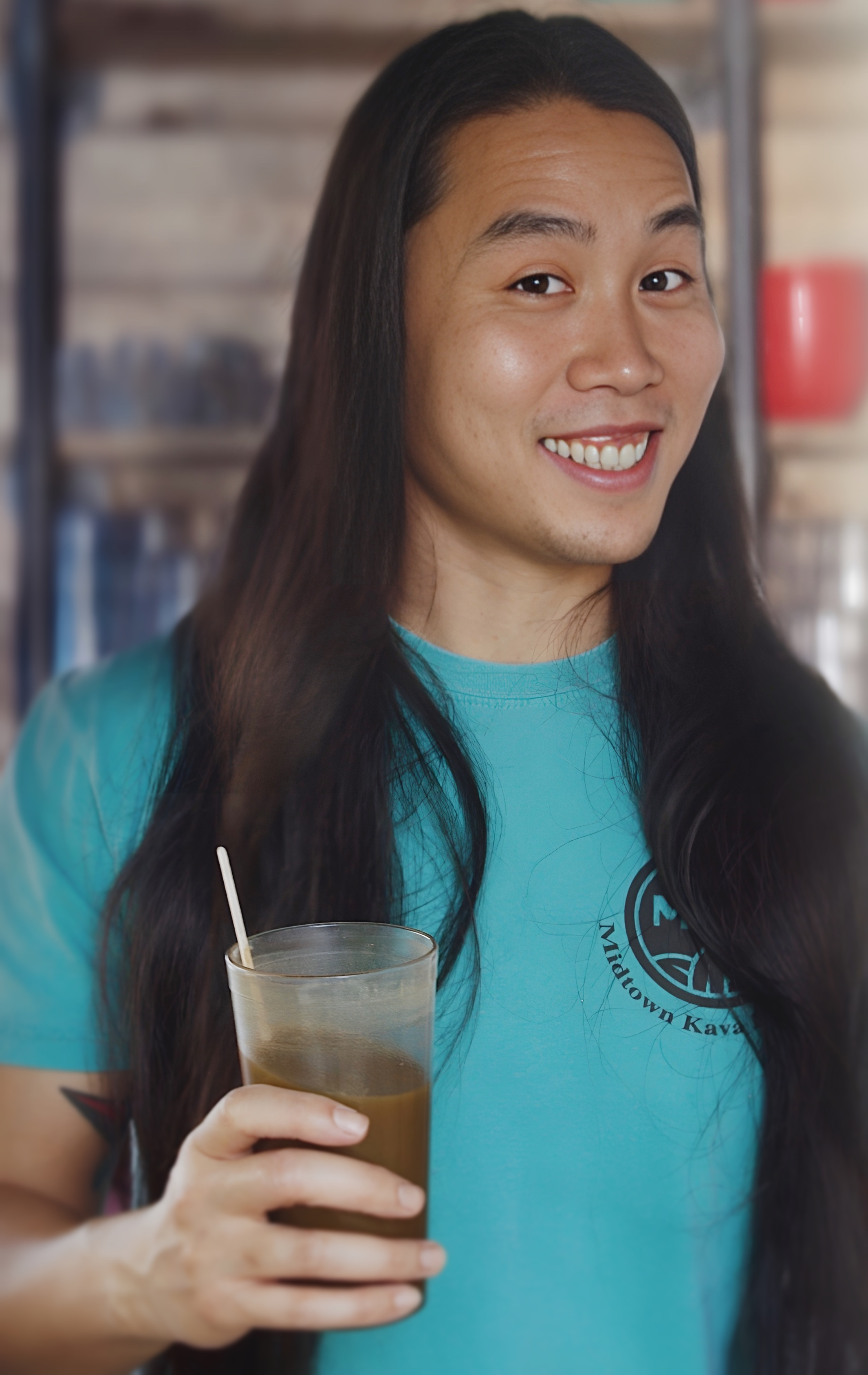 Kevin making a drink behind the bar at MKL
